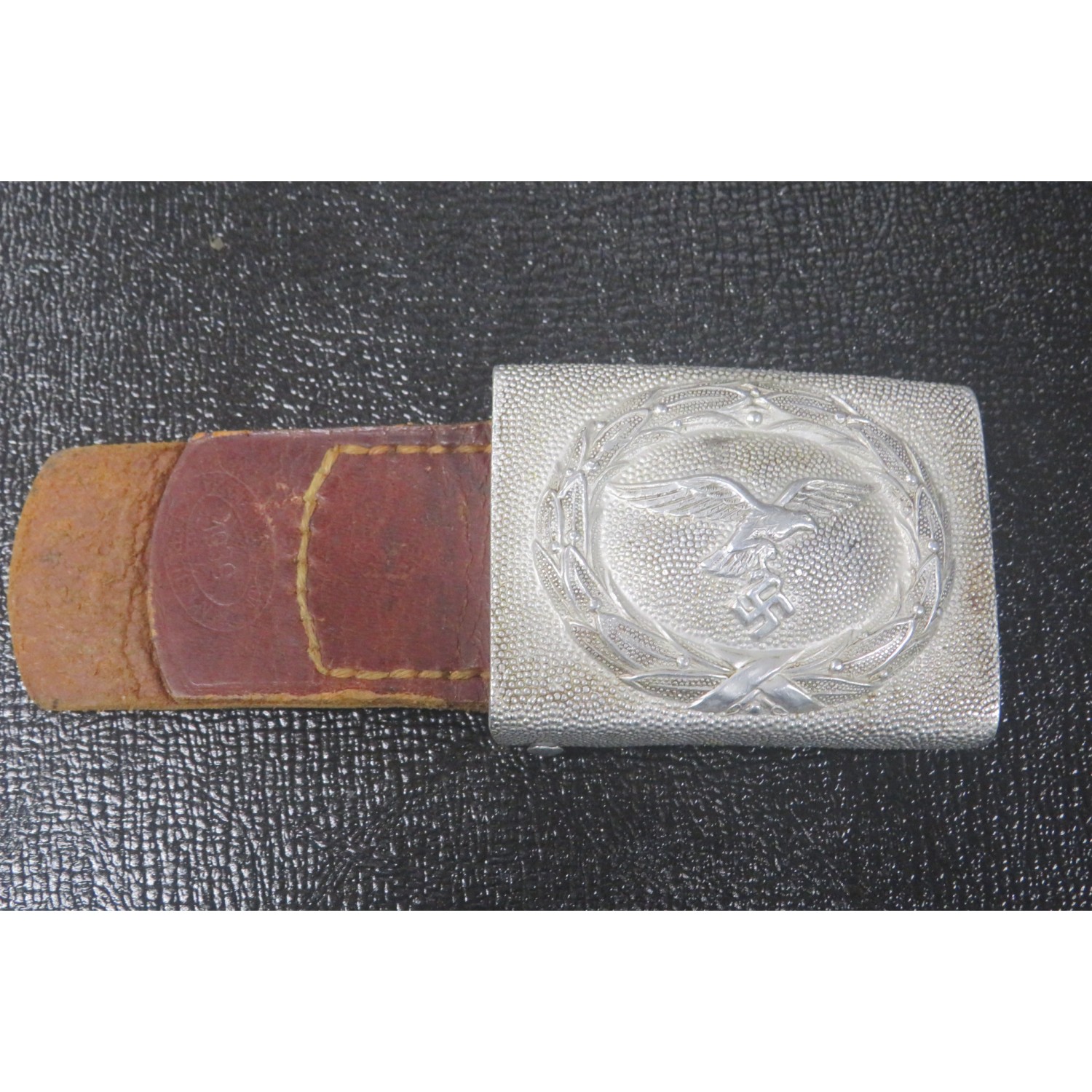 Luftwaffe buckle in aluminum with leather flap, dated 1939