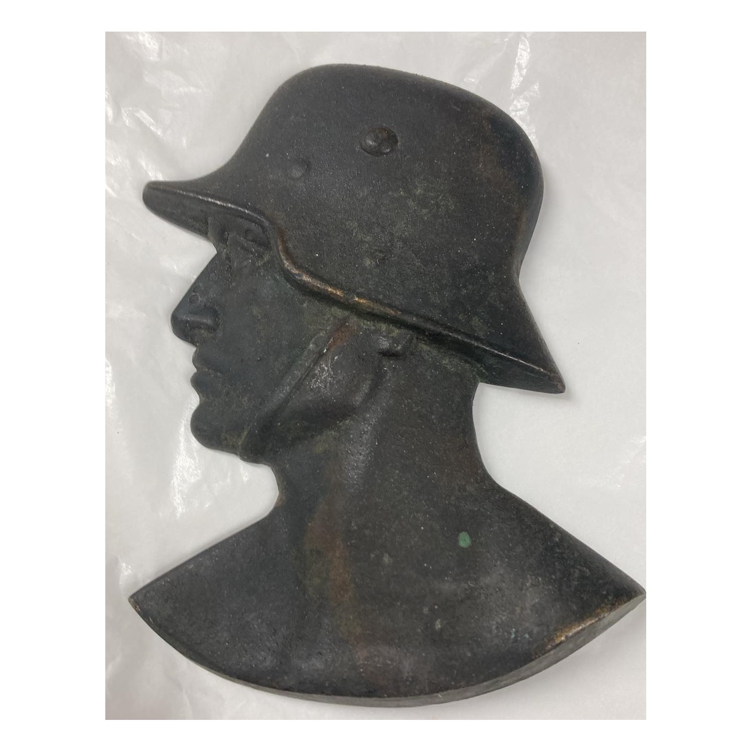 Profile of a German soldier with helmet, 1930s/40s, cast iron