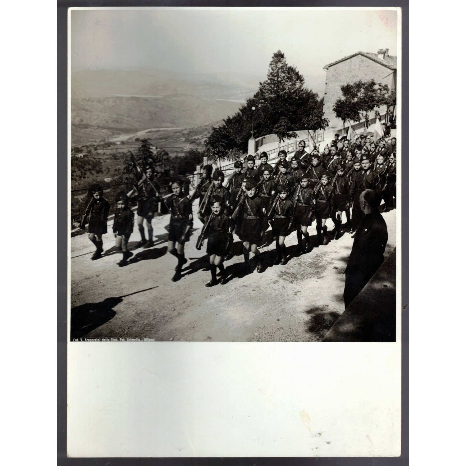 very rare photo of a group of Balilla members of the San Marino Fascist Party marching with banners and pennants