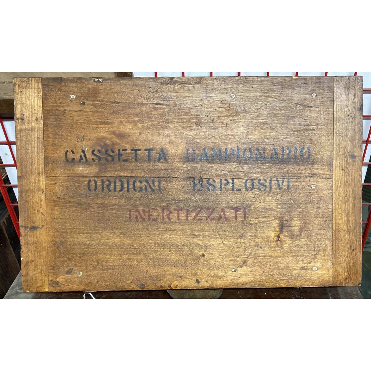 Wooden box for educational use containing inert bombs for schools