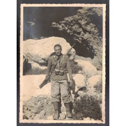 Large-format photograph of a soldier of the Royal Italian Army in a war zone in East Africa