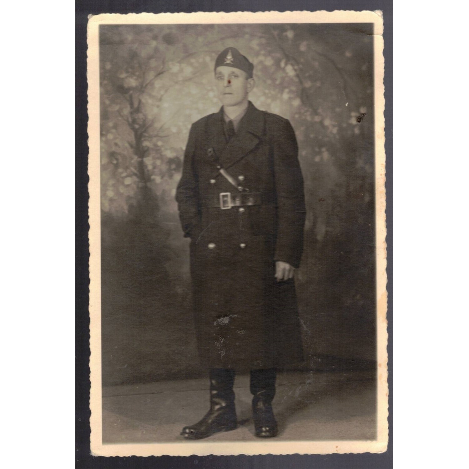 Postcard-sized portrait photo of a firefighter from the 1930s and 1940s