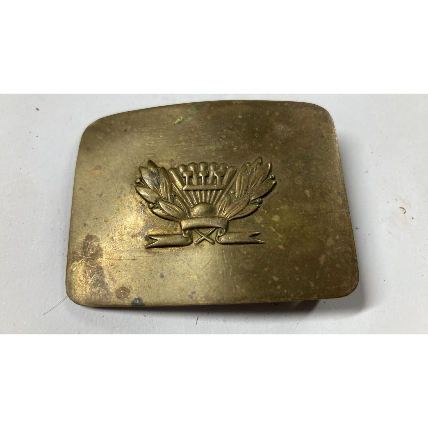 A brass belt buckle for Soviet students, used until 1962