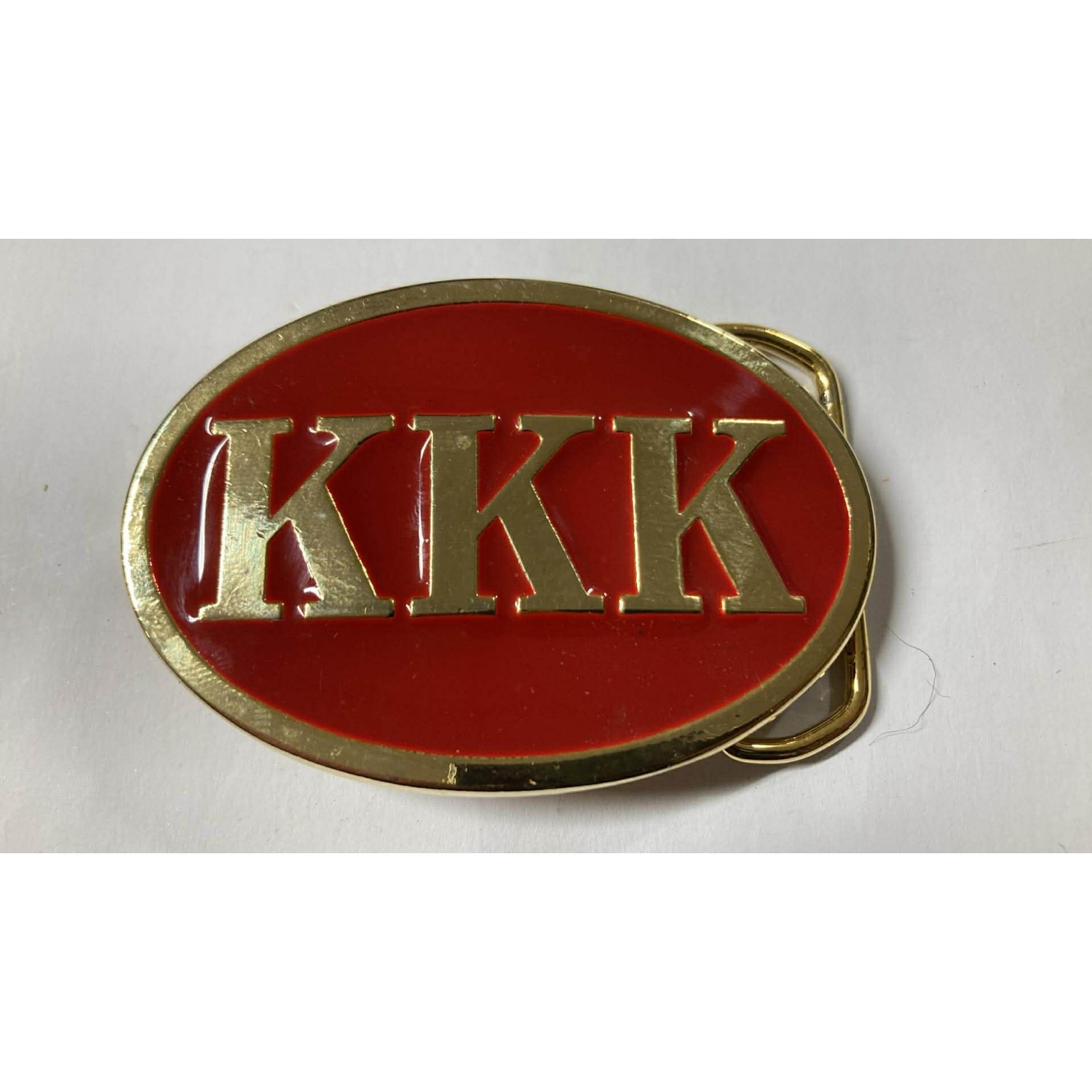 Gold metal and enamel buckle with logo of the supremacist movement KKK Ku Klux Klan, USA 1990s