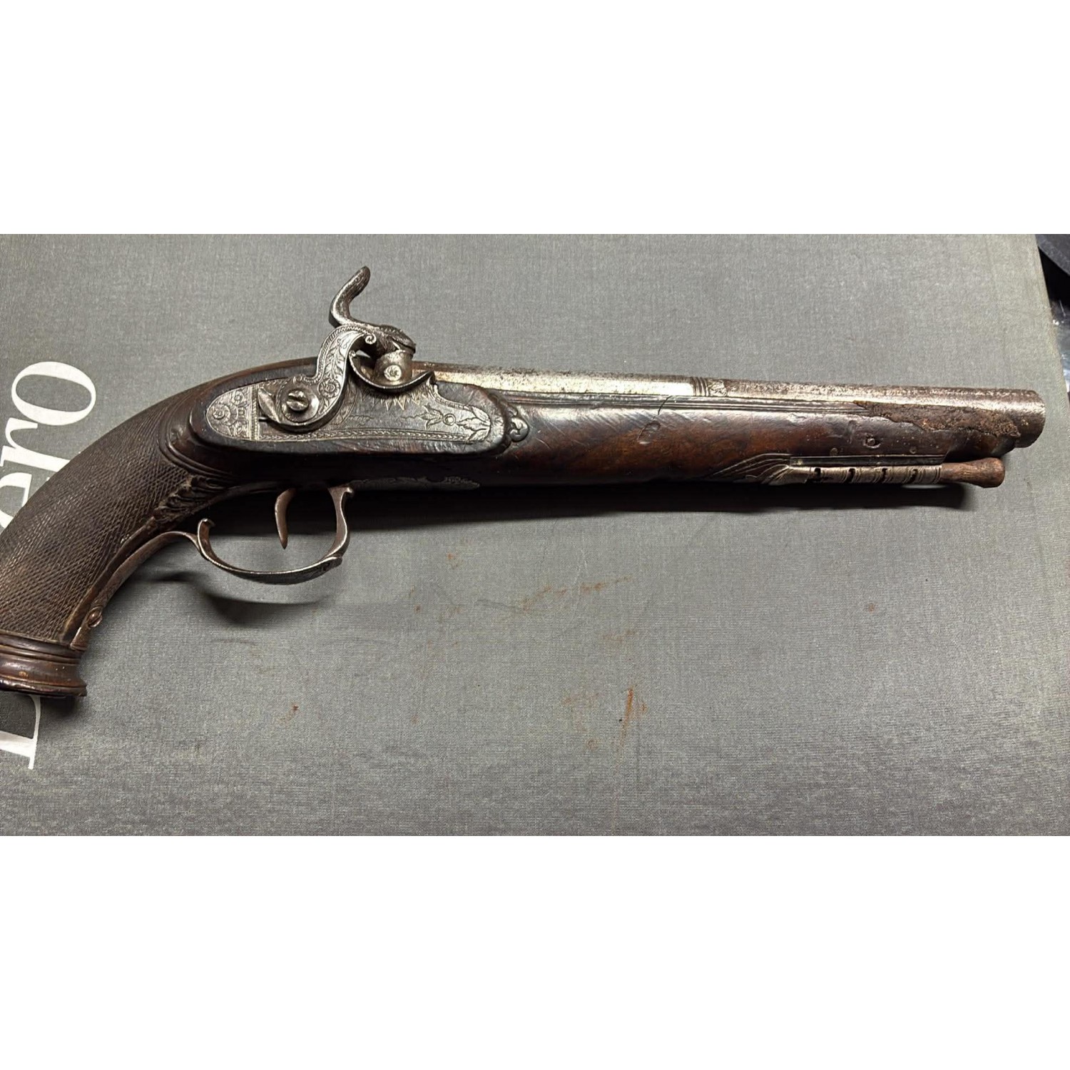 Engraved muzzle-loading pistol