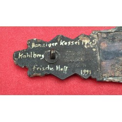 Konvolut bestehend aus einer WH-Gürtelschnalle und einer Nahkampfspange aus einer Ausgrabung