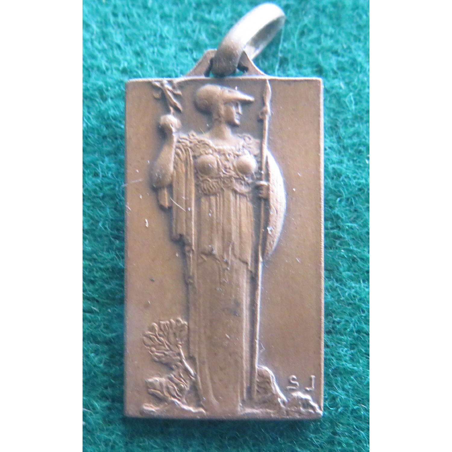 Small bronze medal commemorating the end of the 1st World War I remind the I.T.O. Collaborators
